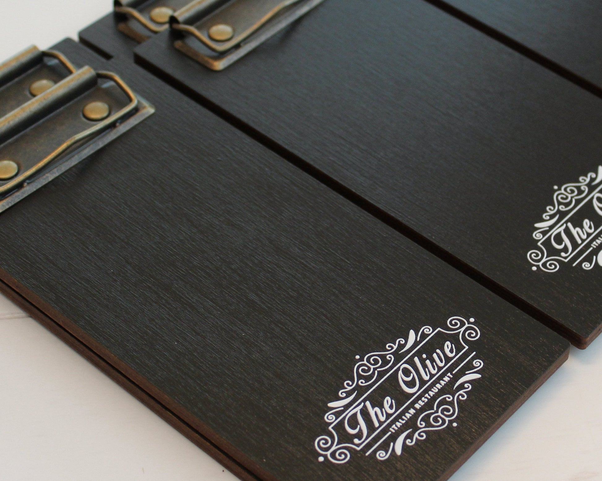 Personalized black-stained bill presenter with antiqued brass clip