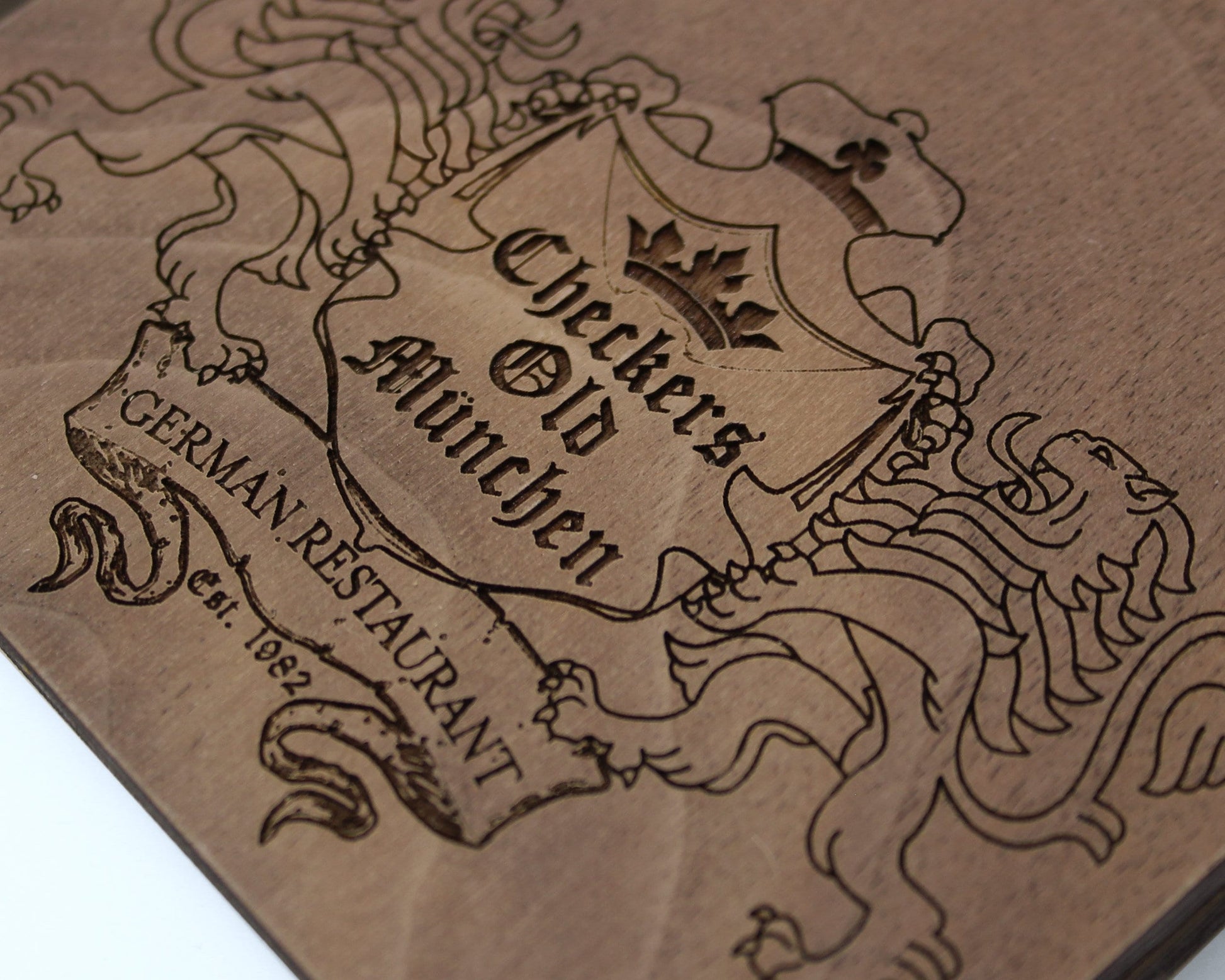 Logo engraved on solid walnut