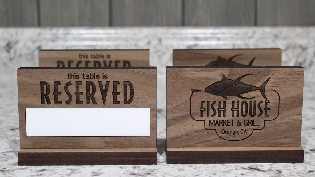 Custom engraved walnut reserved table sign with erasable whiteboard