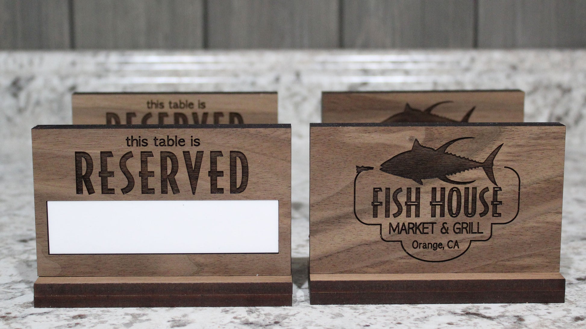 Custom engraved walnut reserved table sign with erasable whiteboard