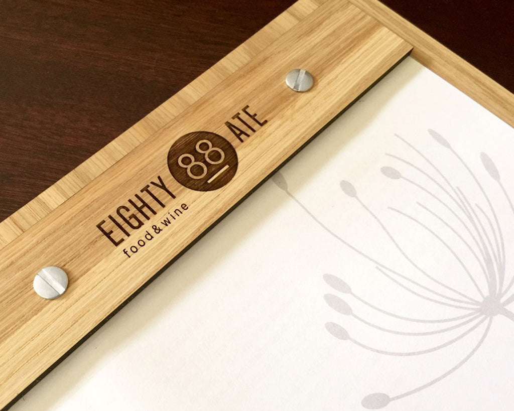 Restaurant bamboo menu display with custom branding