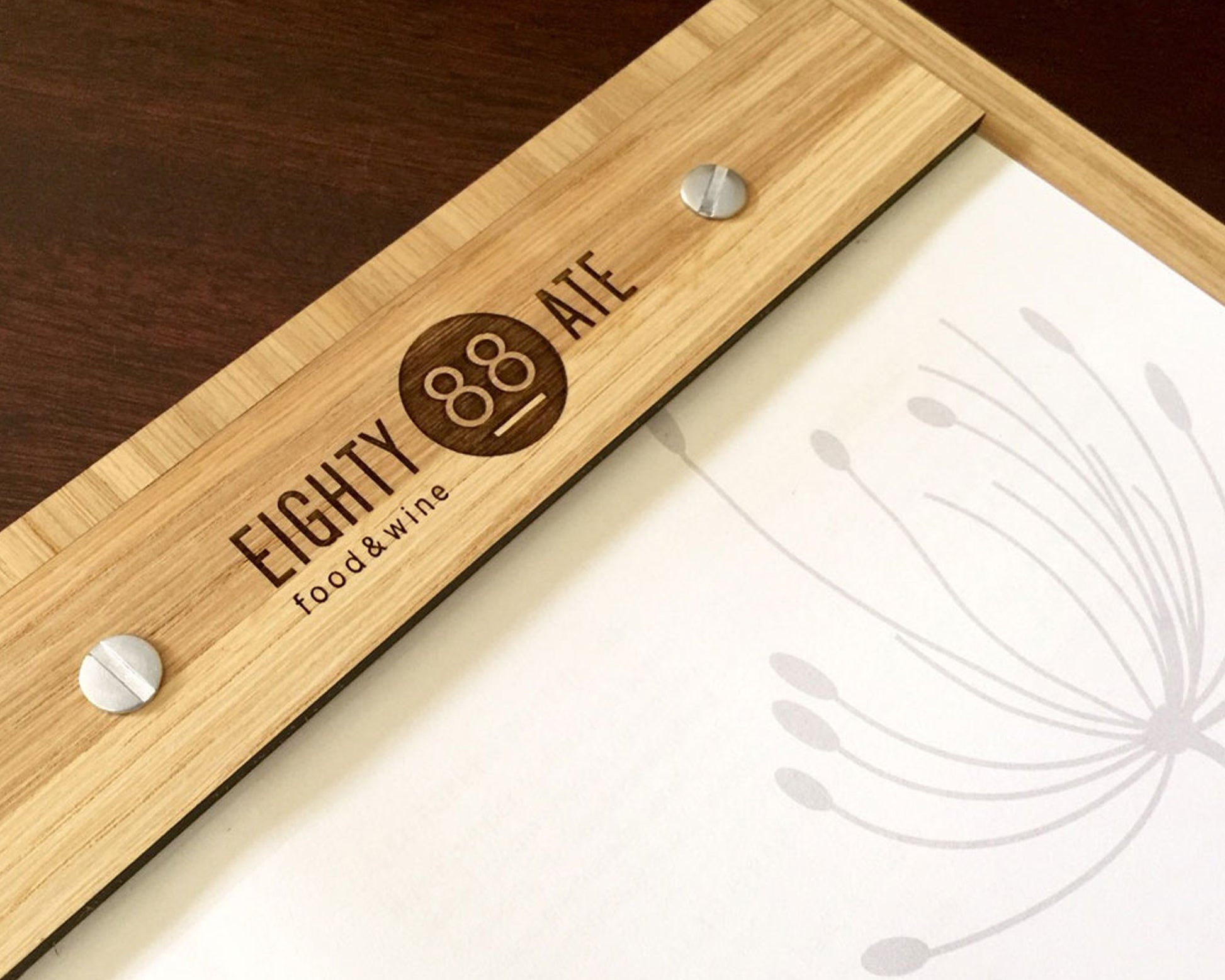 Restaurant bamboo menu display with custom branding