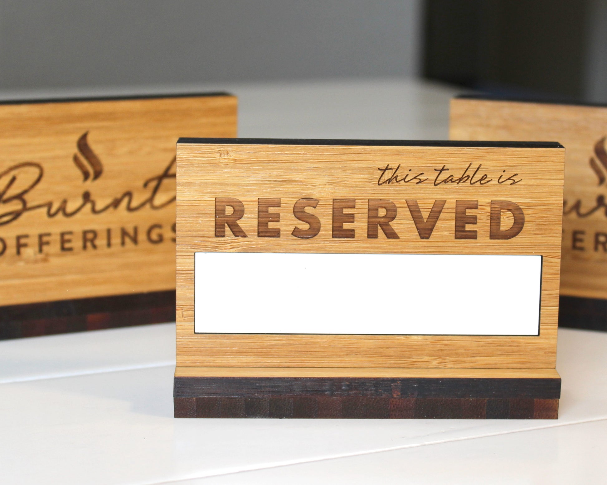 Reusable bamboo reserved tabletop sign with dry erase panel