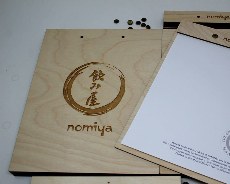Birch menu board engraved with restaurant logo