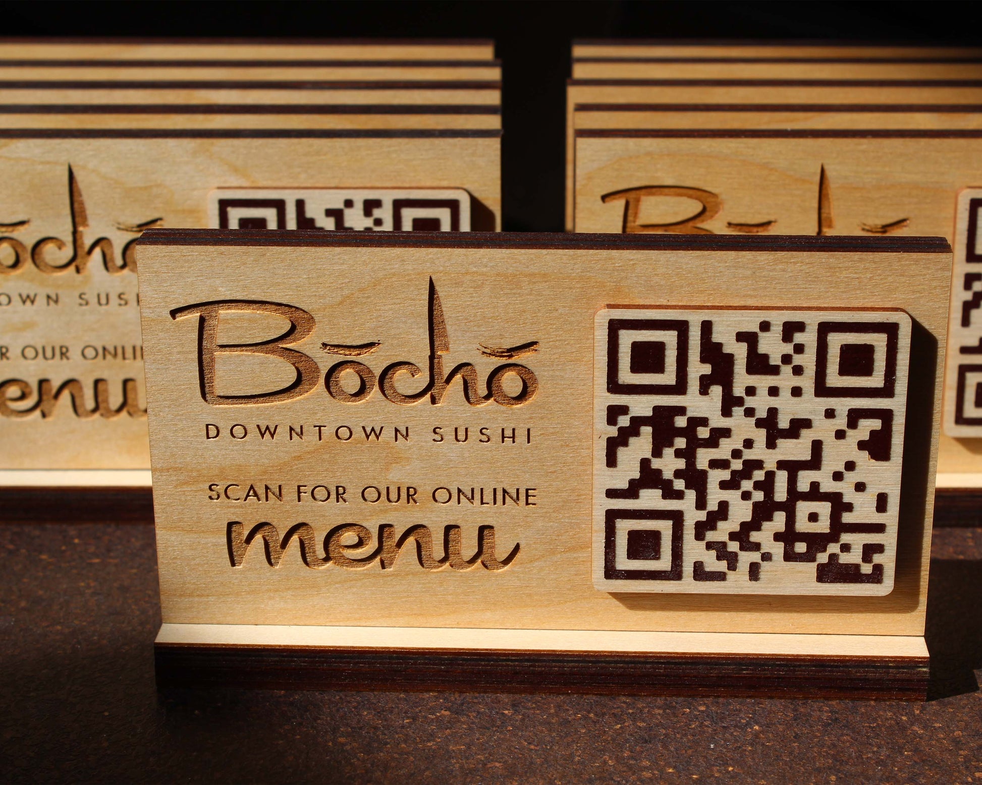 Custom engraved QR menu sign on natural birch plywood