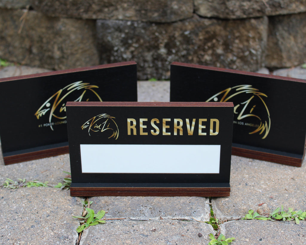 Black birch reserved table sign with dry erase panel and gold UV print