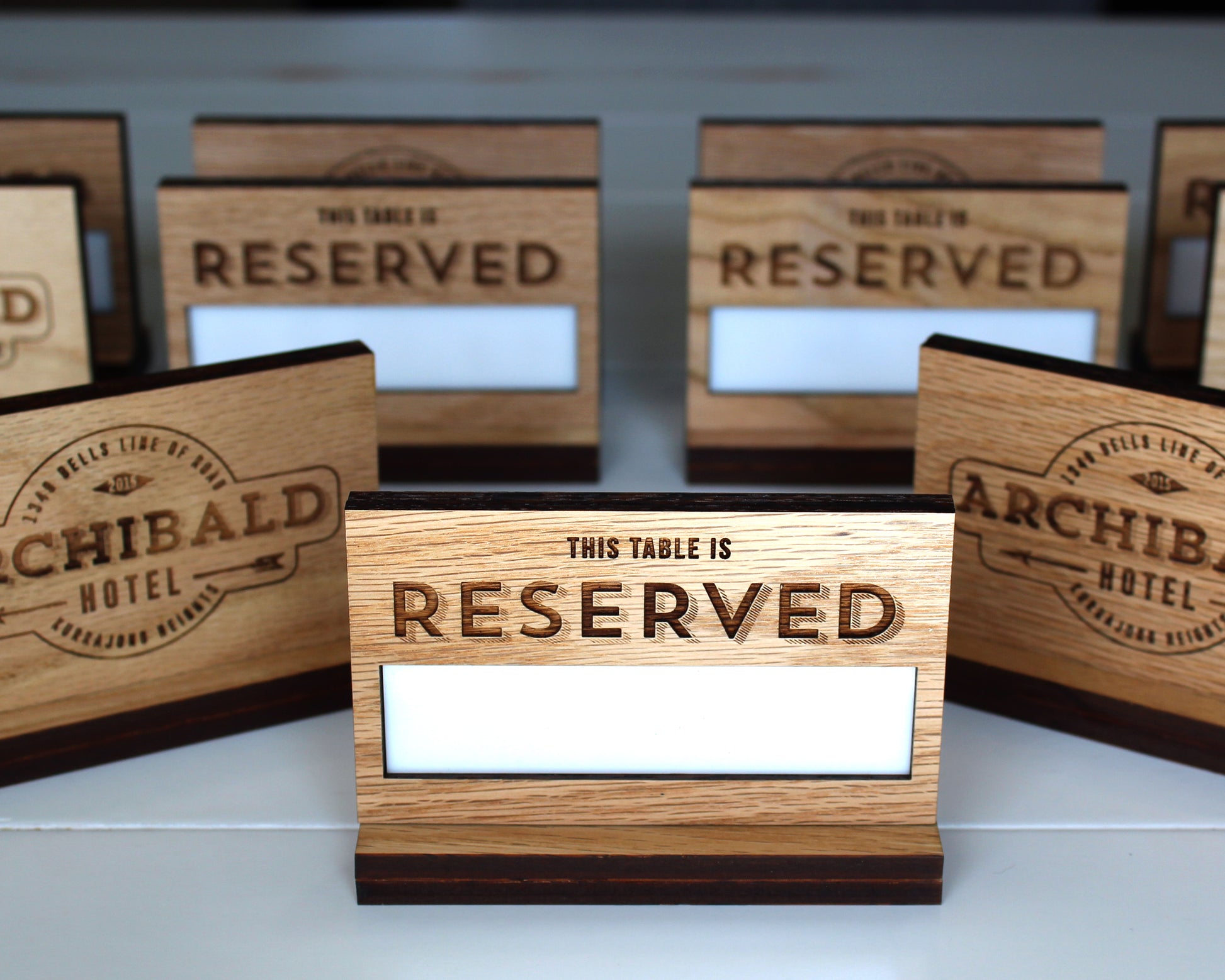 Reusable solid oak table reserved sign with engraved logo