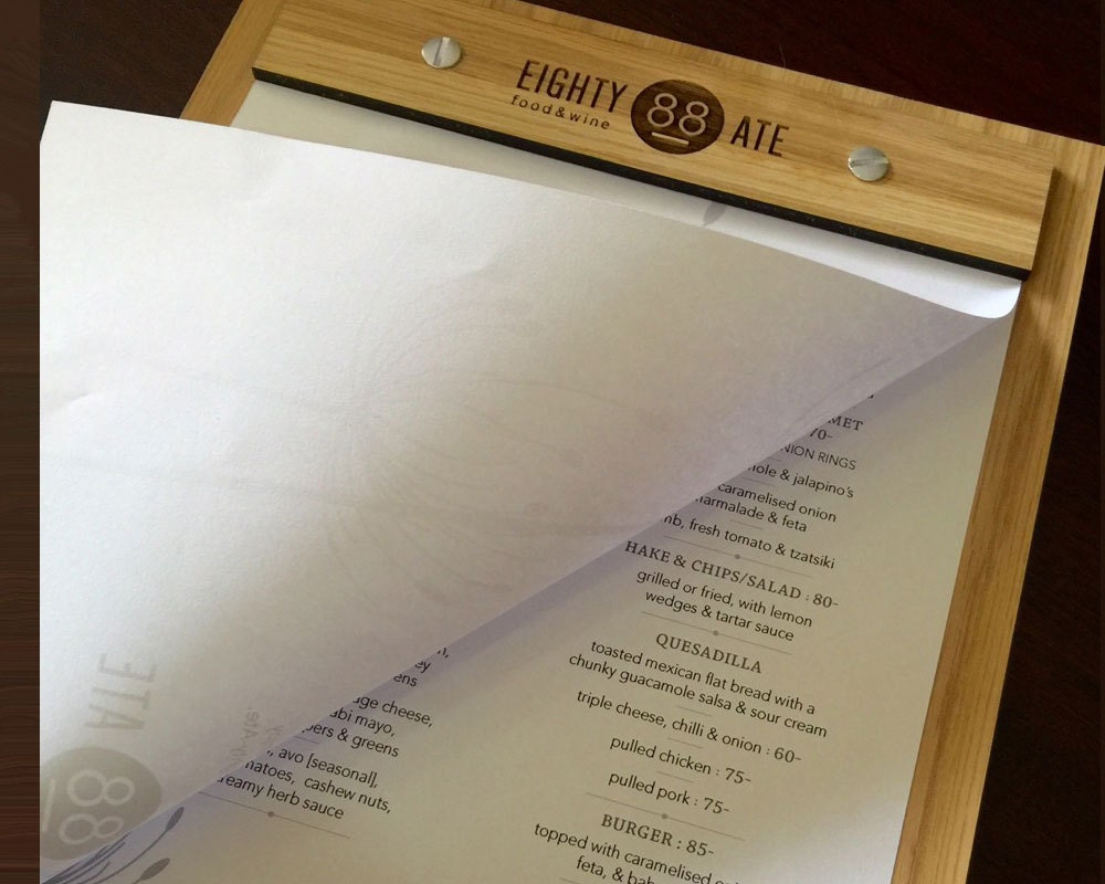 Custom engraved restaurant menu holder in oak finish
