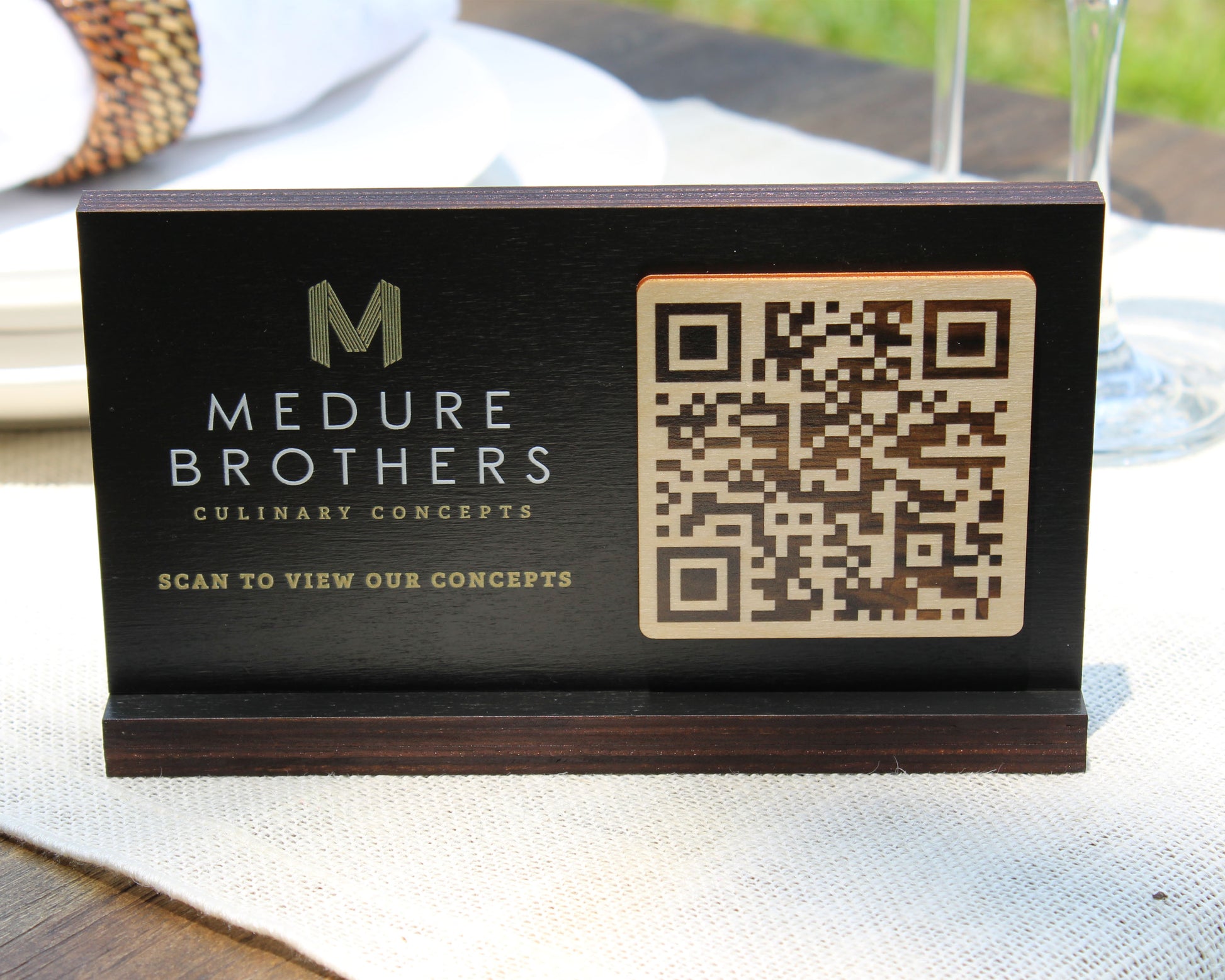 Double-sided QR code sign with black stained birch ply.