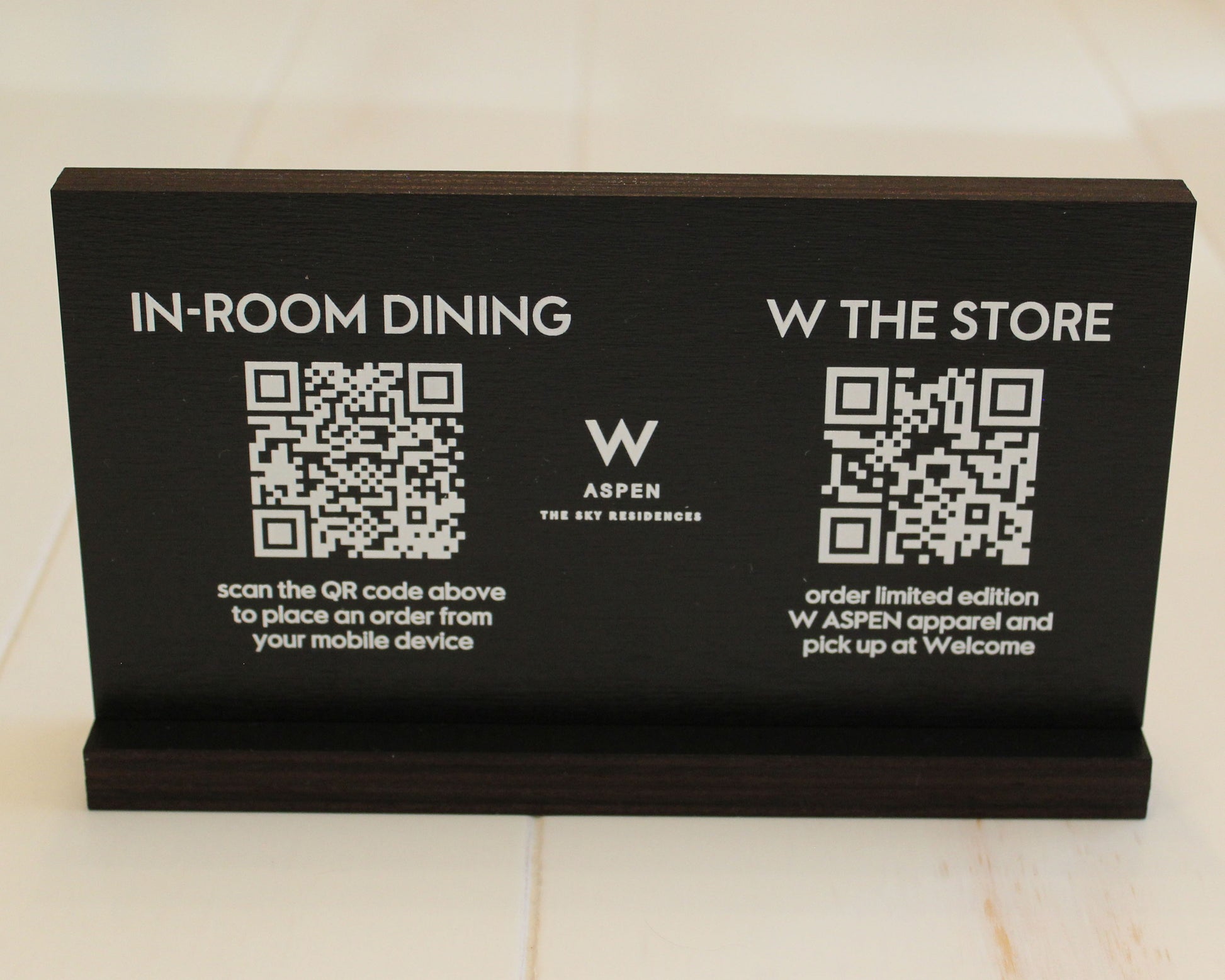 Black stained birch QR code sign for in-room dining menu.