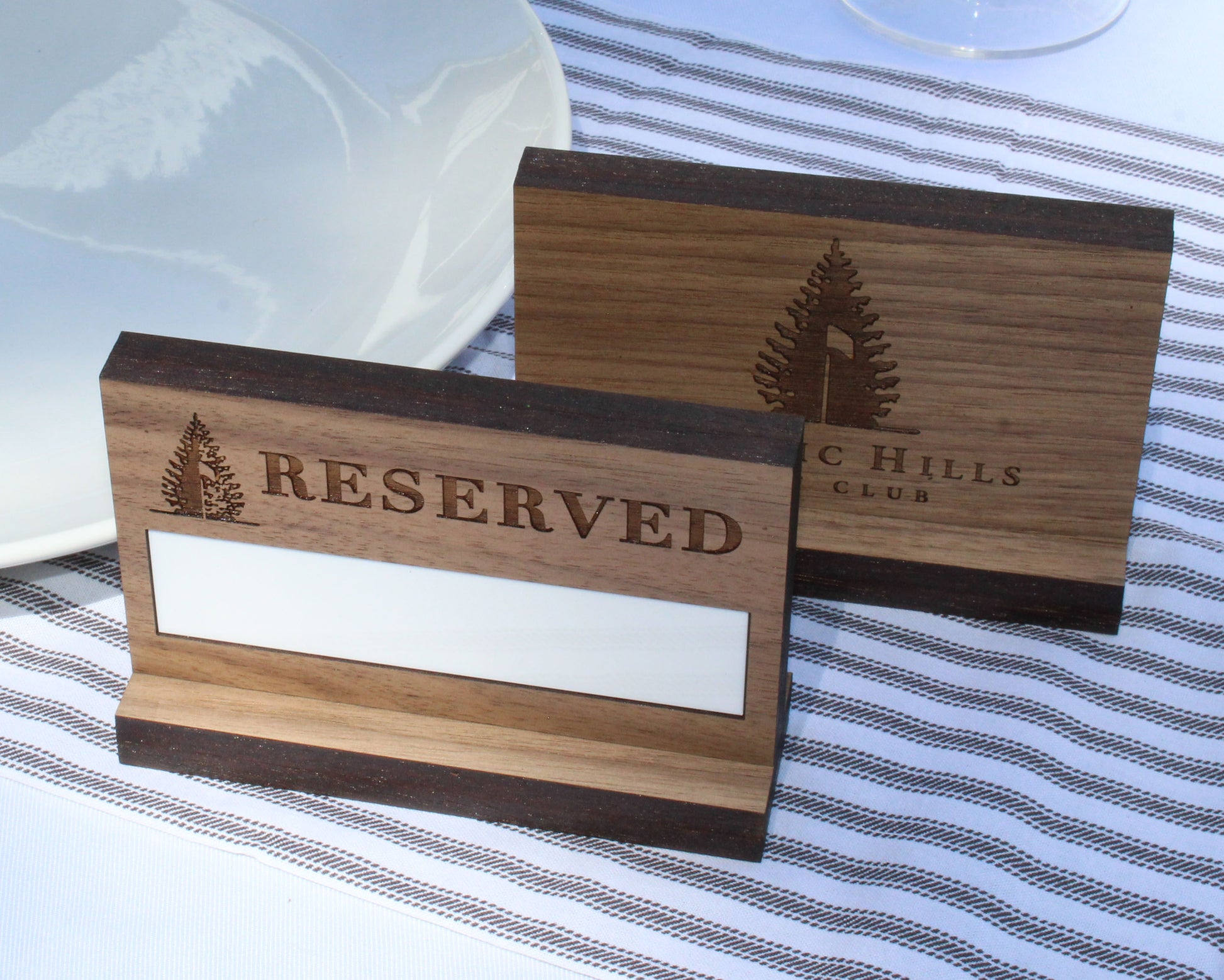 Walnut table reserved sign with dry erase panel