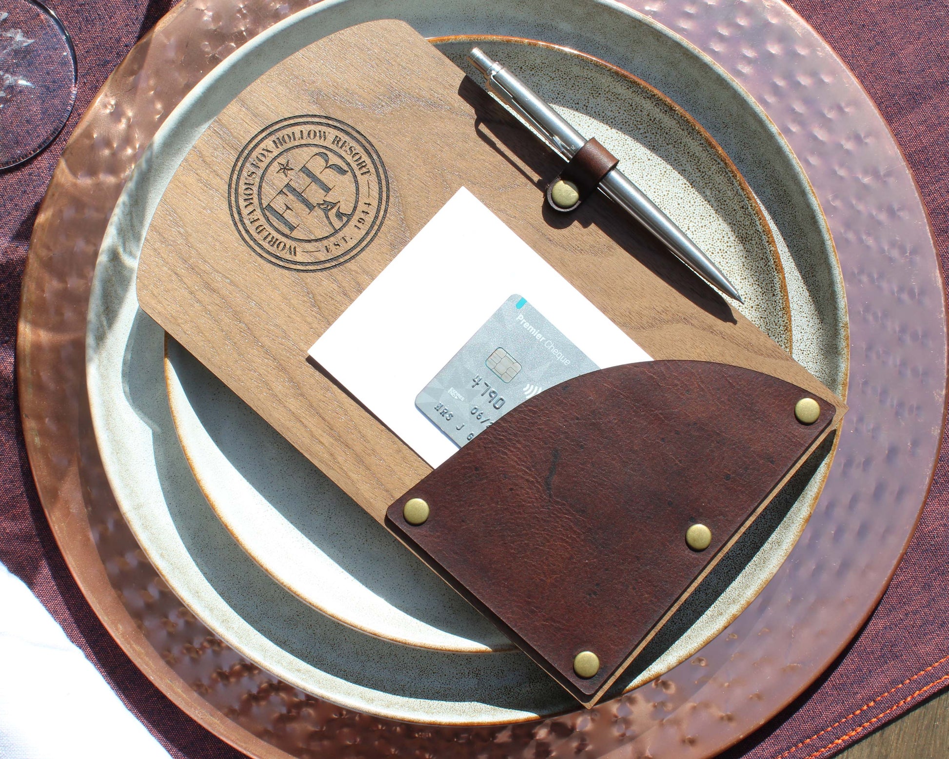 Restaurant bill holder made from walnut veneer and genuine leather