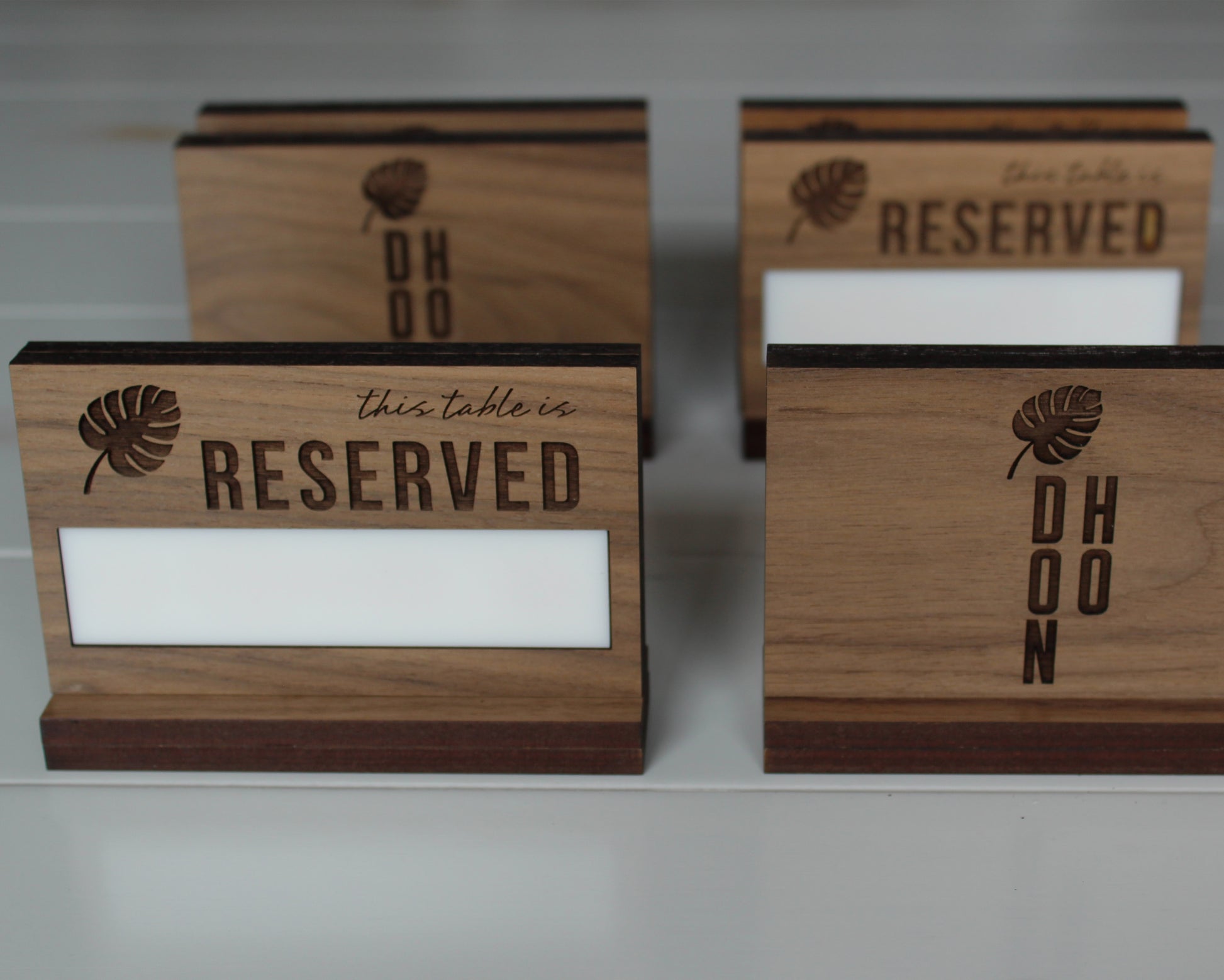 Handcrafted walnut table reserved sign for restaurants