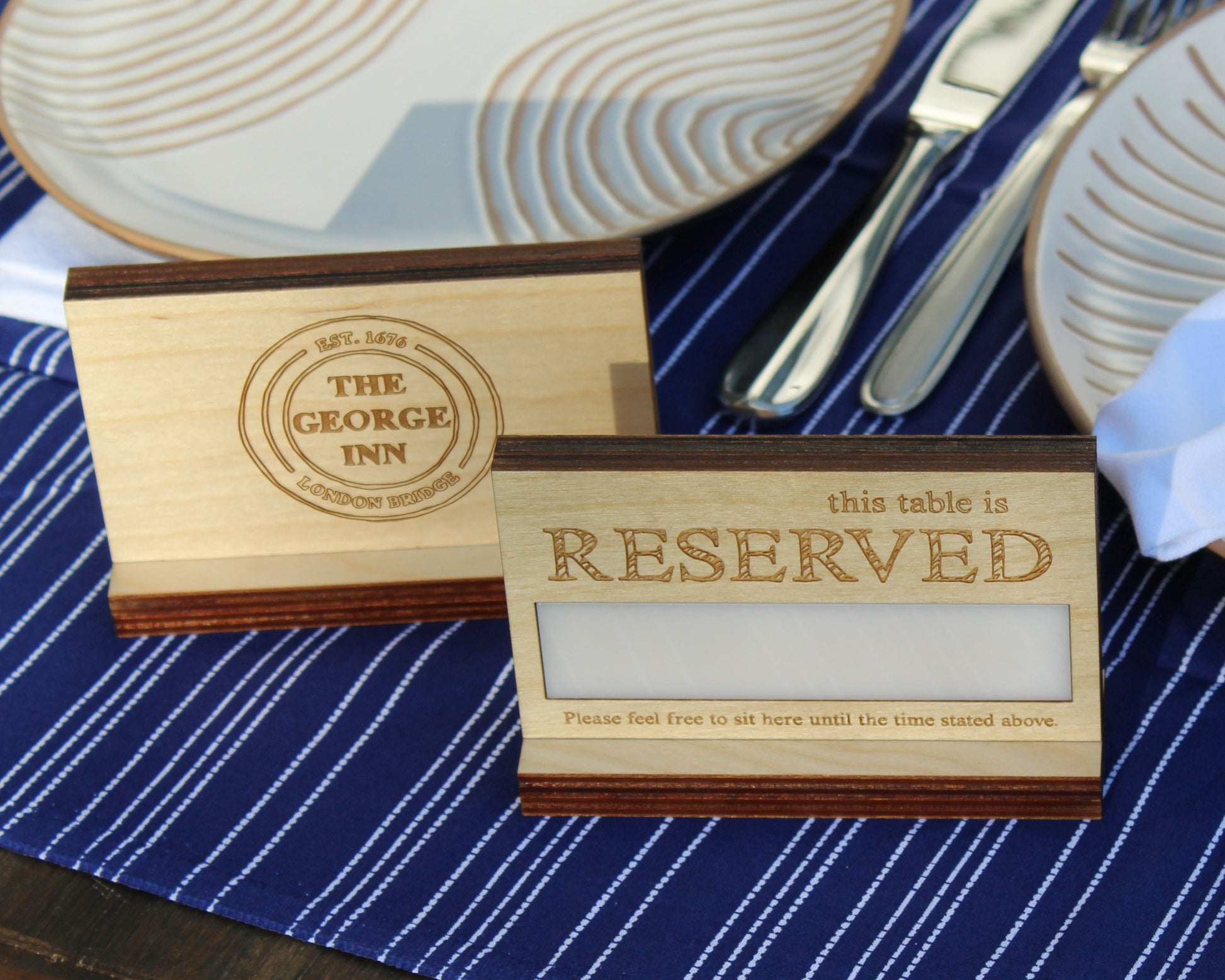 Reserved sign on a table with placement setting