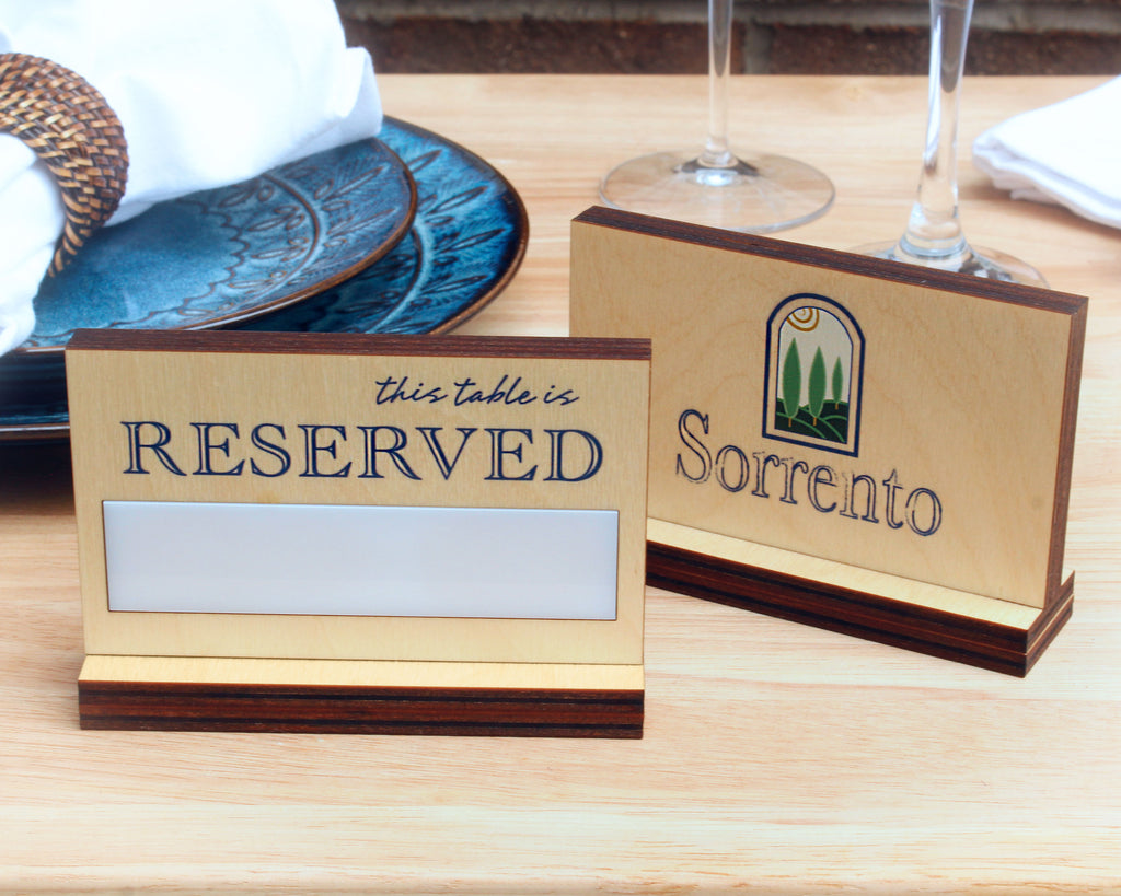 Reserved sign with erasable panel on a restaurant table setting