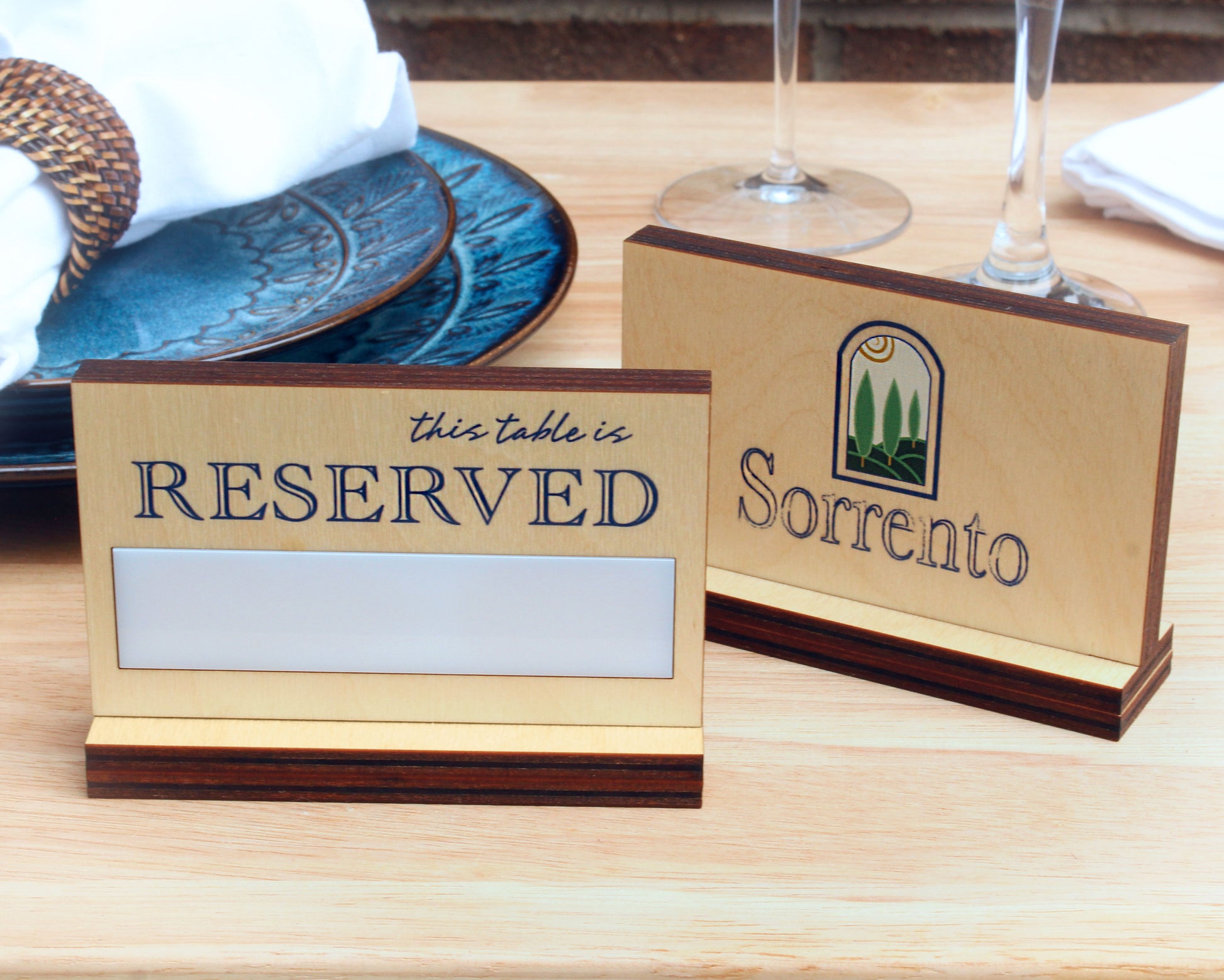 Reserved sign with erasable panel on a restaurant table setting